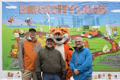 President David C. Munson Jr., Dean James and Leigh Rubin Winebrake at the BrickCityLand mural unveiling